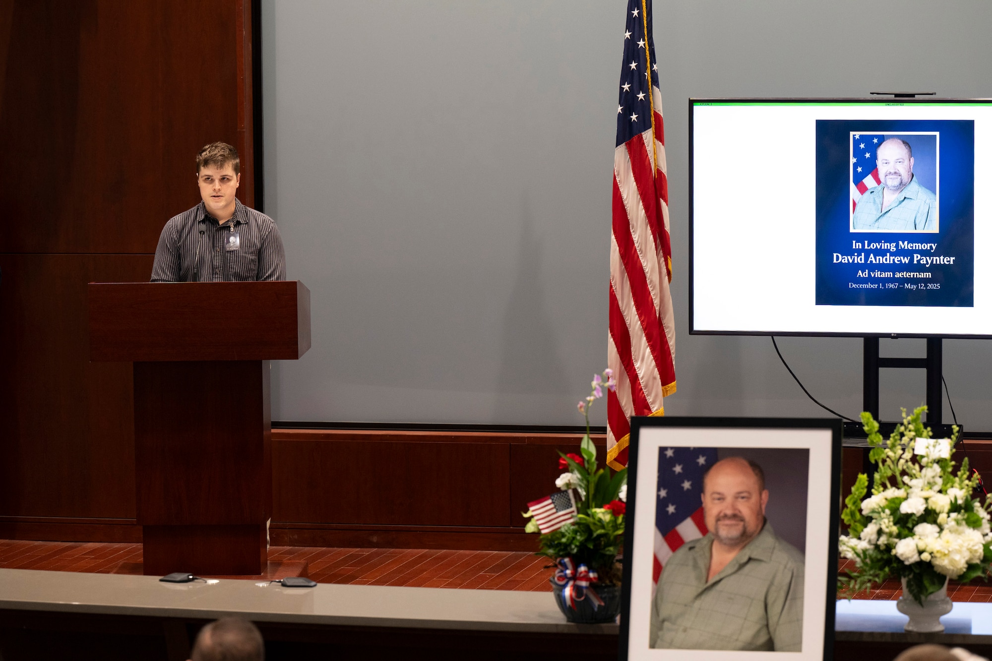 Sam Paynter, son of the late David A. Paynter, delivers a eulogy honoring his father’s legacy at a memorial service Aug. 11, 2025.  Paynter was a member of the Air Force Technical Applications Center and served as the center’s A-4 Director of Logistics as well as the deputy director of the 709th Support Squadron at Patrick Space Force Base, Fla.   (U.S. Air Force photo by Matthew S. Jurgens)