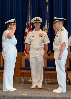 250812-O-NJ594-1211, GREAT LAKES, Illinois (Aug. 12, 2025) Cmdr. Jason Schmittschmitt, the outgoing commanding officer of Navy Drug Screening Lab Great Lakes (NDSL GL), right salutes Cmdr. Katherine Dozier, left, the oncoming commanding officer, in front of the presiding officer of the ceremony, Capt. Darryl Arfsten, commander, Navy and Marine Corps Force Health Protection Command (NMCFHPC) and director, Defense Center for Public Health – Portsmouth (DCPH P), during a change of command ceremony in Great Lakes, Illinois, August 12, 2025. Schmittschmitt will be retiring from the Navy in October. (U.S. Navy photo by Lt. Cmdr. Dan Xu)