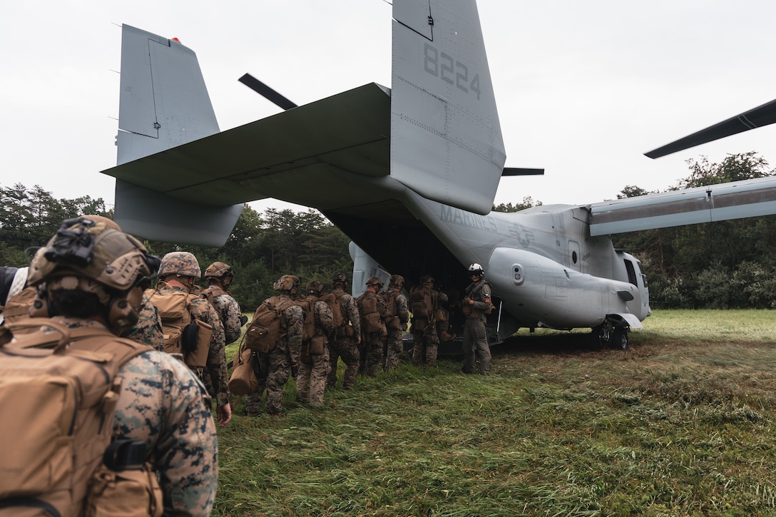U.S. Marines with Golf Company, 2nd Battalion, 2nd Marine Regiment, board an MV-22 Osprey tiltrotor aircraft with Marine Medium Tiltrotor Squadron 261 (VMM-261) for a flight at Marine Corps Base Quantico, Virginia, Aug. 5, 2025. 2nd Bn., 2nd Marines, the ground combat element of the Special Purpose Marine Air-Ground Task Force-Alert Contingency MAGTF, conducted a deployment for training in order to enhance operational readiness and overall unit cohesion. (U.S. Marine Corps photo by Sgt. Jorge Borjas)