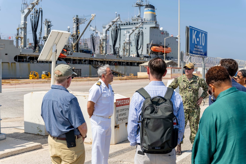 Capt. Thomas Tsilis, commanding officer, Marathi Fuel Depot and K14 Cold Iron Facility, stands alongside Capt. Stephen Steacy, commanding officer, Naval Support Activity (NSA) Souda Bay and explains key functions of the NATO Marathi Pier Complex during a congressional delegation visit on Aug. 9, 2025.
