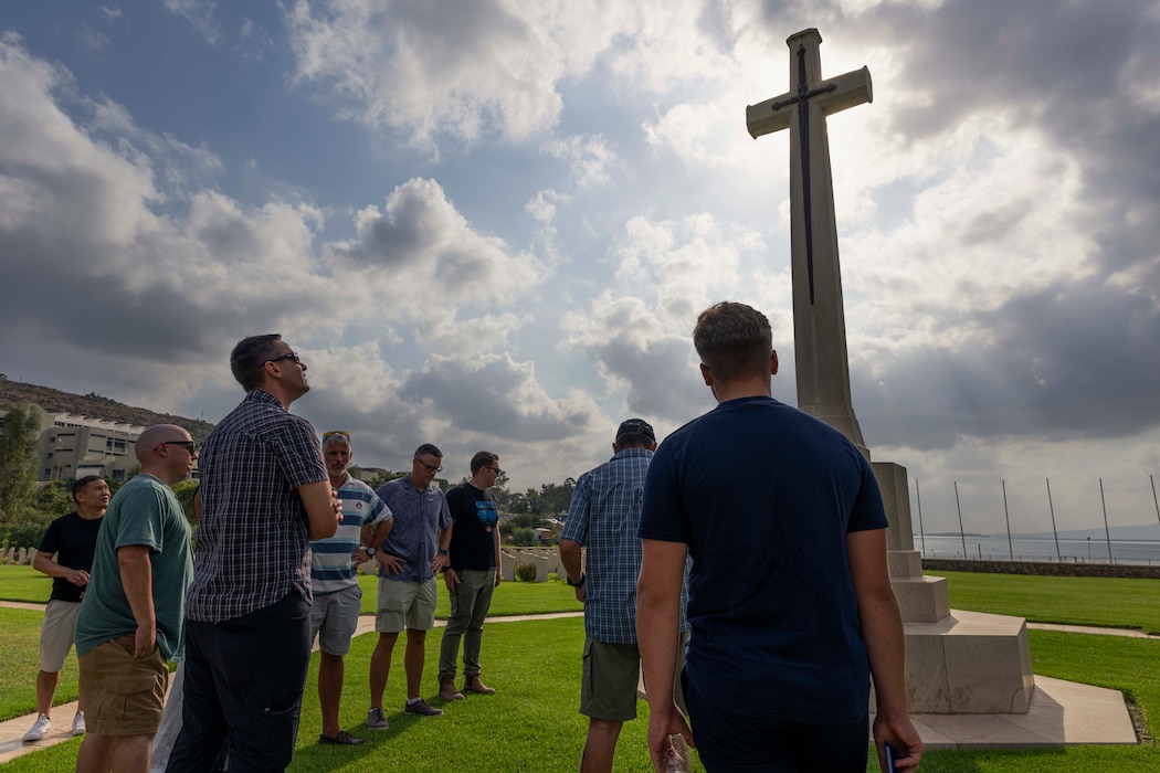 Alan McWilliams, gives a tour to Sailors assigned to Naval Support Activity (NSA) Souda Bay of the Souda War Cemetery in Souda Bay, Greece, on Aug. 8, 2025.