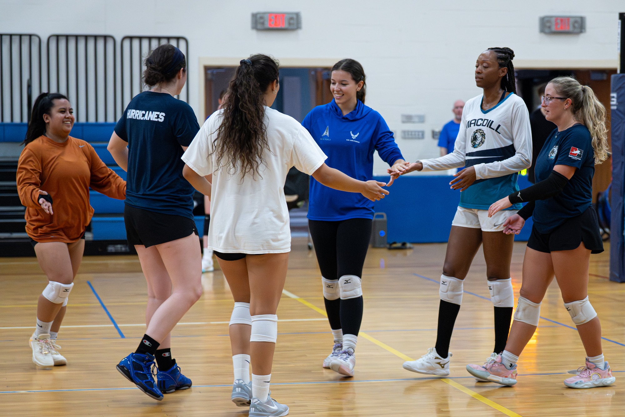 U.S. Air Force 2nd Lt. Jaqueline Gonzales-Brown, 6th Maintenance Squadron fabrication flight commander, practices with MacDill’s Hurricane Varsity Volleyball team  at MacDill Air Force Base, Florida, Aug. 13, 2025. Gonzales-Brown demonstrates that excellence comes from mastering the basics and building up the team. (U.S. Air Force photo by Airman 1st Class Helen Ly)