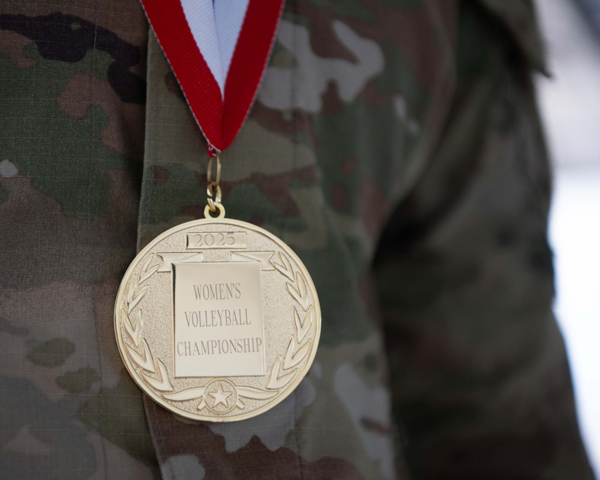 U.S. Air Force 2nd Lt. Jaqueline Gonzales-Brown, 6th Maintenance Squadron fabrication flight commander, poses with her 2025 Armed Forces Volleyball Championship  gold medal at MacDill Air Force Base, Florida, Aug. 19, 2025. The Department of the Air Force women’s volleyball team rallied after a single loss to the U.S. Army team, winning their next four matches to claim the title. (U.S. Air Force photo by Airman 1st Class Helen Ly)