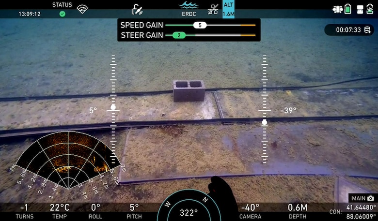 The underwater rover’s command screen provides critical information of its’ surroundings using a series of high-resolution cameras and high-fidelity sensors.