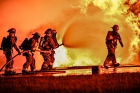 U.S. Army National Guard firefighters of the 1049th Engineer Detachment, Montana Army National Guard, respond to a nighttime fire training scenario during Northern Strike 25-2 at Grayling Army Airfield, Michigan, Aug. 4, 2025.