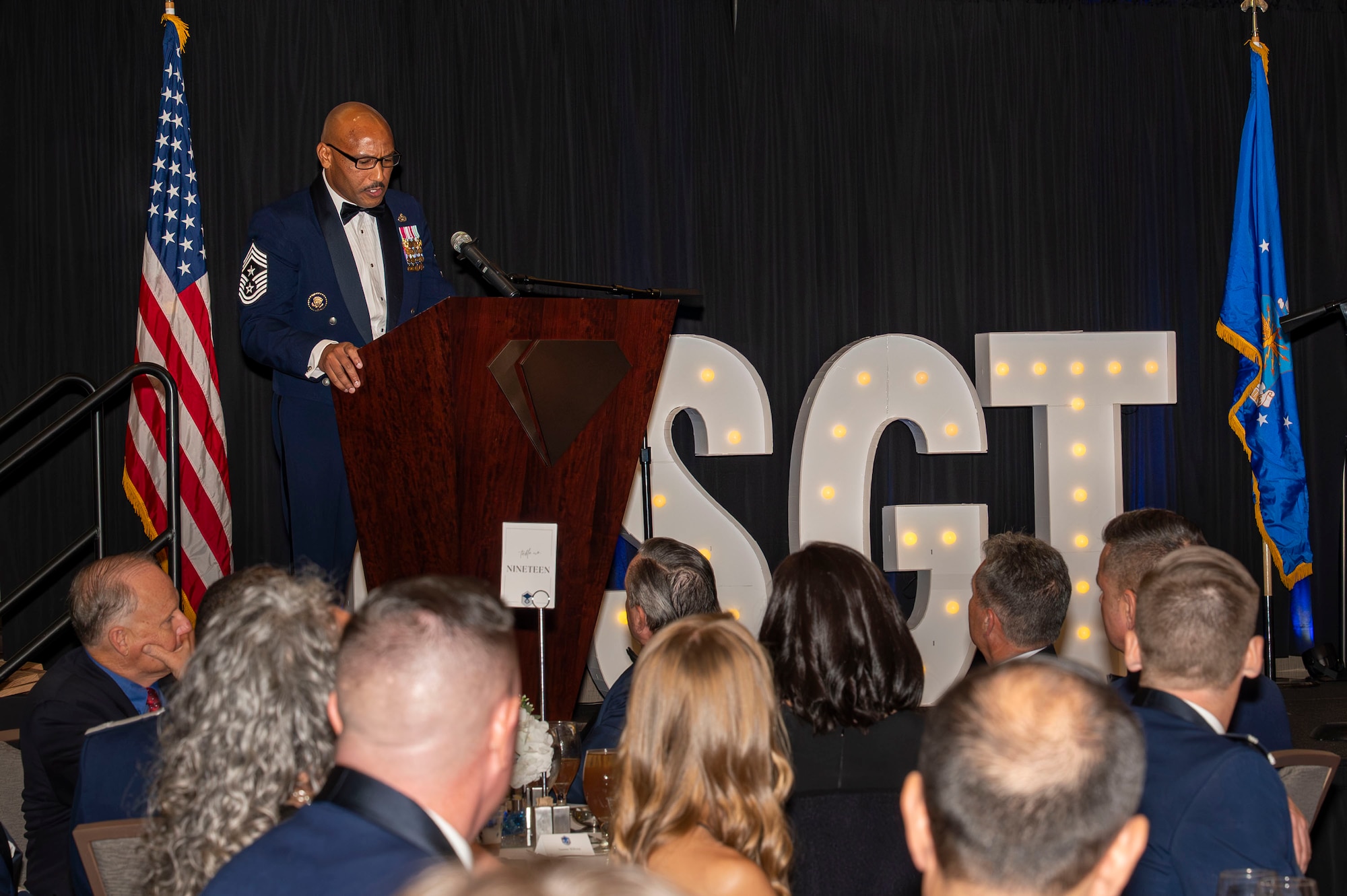 U.S. Air Force Chief Master Sgt. Kelvin Hatcher, 355th Wing command chief, delivers remarks during the Senior Noncommissioned Officer Induction ceremony in Tucson, Arizona, Aug. 15, 2025. The ceremony recognized Airmen selected for promotion to the rank of master sergeant. (U.S. Air Force photo by Airman 1st Class Samantha Melecio)