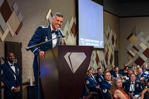 U.S. Air Force Col. Jose Cabrera, 355th Wing commander, offers closing remarks during the Senior Noncommissioned Officer Induction ceremony in Tucson, Arizona, Aug. 15, 2025. The ceremony honored newly selected master sergeants and highlighted their transition into senior leadership roles. (U.S. Air Force photo by Airman 1st Class Samantha Melecio)