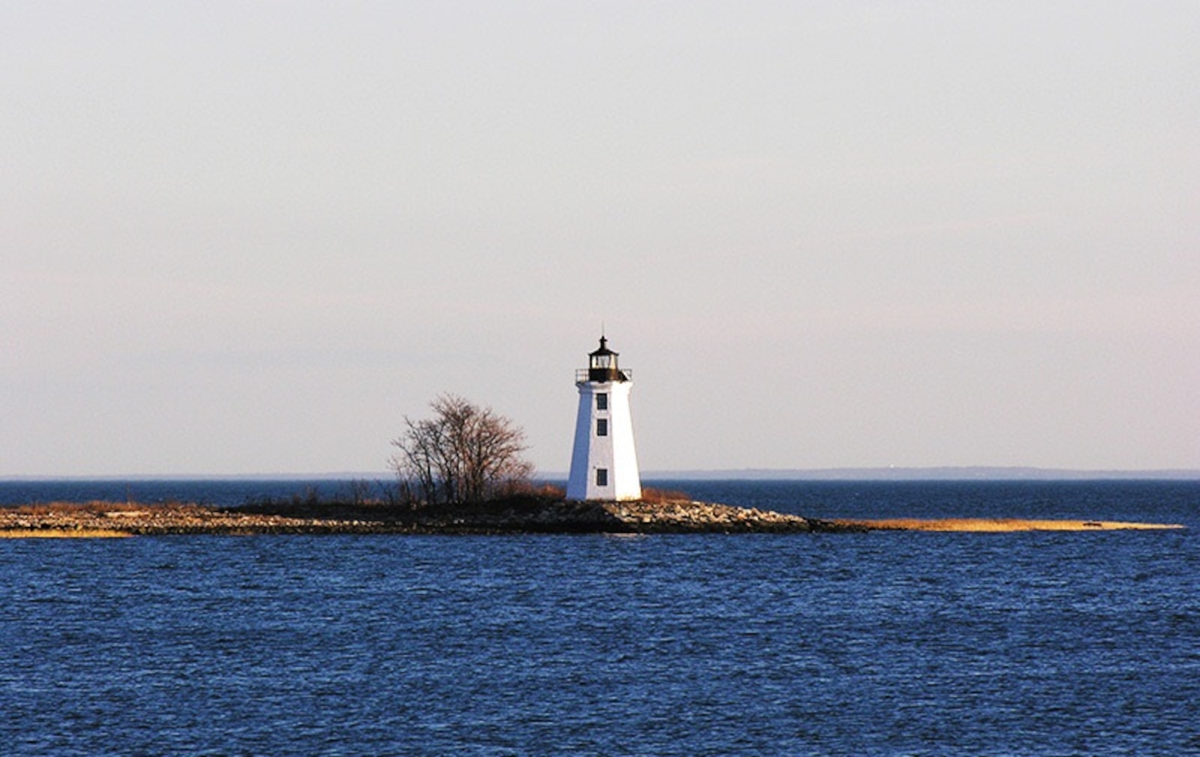 Current image of the 200-year-old Black Rock Light standing as a lone sentinel on Fayerweather Island. (Wikipedia)