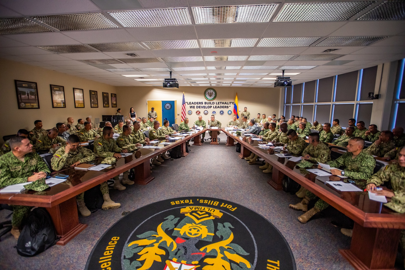 U.S. Army Sgt. Maj. of the Army Michael Weimer, center, speaks to Programa Integral para Suboficiales de Alta Jerarquía (PISAJ) 21 participants and facilitators from the U.S. and Colombian militaries about the roles and responsibilities of senior enlisted leaders at the U.S. Army Sergeants Major Academy at Fort Bliss, Texas, Aug. 18, 2025. PISAJ is a biannual, partner nation-funded initiative aligned with U.S. Southern Command’s Theater Campaign Plan and directly supports the Colombian army’s transformation to align its noncommissioned officer corps with globally recognized standards. (U.S. Army photo by Staff Sgt. Joshua Taeckens)
