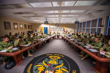 U.S. Army Sgt. Maj. of the Army Michael Weimer, center, speaks to Programa Integral para Suboficiales de Alta Jerarquía (PISAJ) 21 participants and facilitators from the U.S. and Colombian militaries about the roles and responsibilities of senior enlisted leaders at the U.S. Army Sergeants Major Academy at Fort Bliss, Texas, Aug. 18, 2025. PISAJ is a biannual, partner nation-funded initiative aligned with U.S. Southern Command’s Theater Campaign Plan and directly supports the Colombian army’s transformation to align its noncommissioned officer corps with globally recognized standards. (U.S. Army photo by Staff Sgt. Joshua Taeckens)