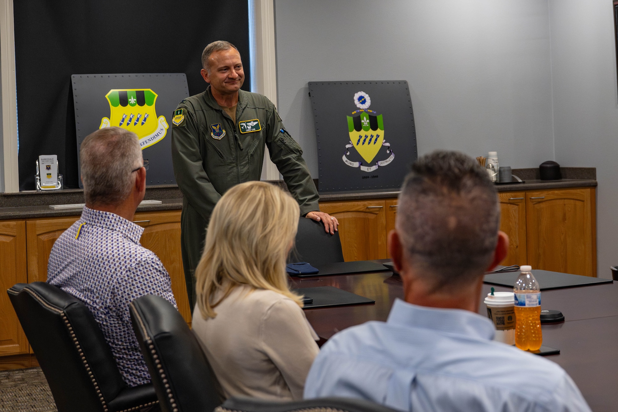 U.S. Air Force Col. Chris Cain, 2nd Bomb Wing commander, gives a mission brief to honorary commanders