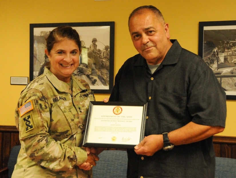 U.S. Army Reserve Ambassador Jeffrey Morton of Maine receives the Patriotic Public Service Award July 17 during an annual training workshop held at 99th Readiness Division headquarters on Joint Base McGuire-Dix-Lakehurst, New Jersey. The award was presented by Maj. Gen. Kris A. Belanger, former 99th RD commanding general. (U.S. Army photo by Mr. Sal Ottaviano, 99th RD Public Affairs)