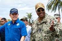 U.S. Navy Admiral Alvin Holsey, the commander of U.S Southern Command (USSOUTHCOM), speaks with Frank Abrego, the Minister of Public Security of Panama at Aeronaval Base Cristóbal Colón, Aug. 17, 2025. Holsey and Abrego visited a jungle orientation course, observing U.S. Marines being taught jungle survival skills from a combined instructor team of U.S. Army and Panamanian security institution members. (U.S. Air Force photo by Capt. Jymil Licorish)
