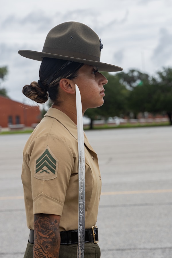U.S. Marine Corps Sgt. Araceli Bravo a drill instructor with Echo Company, 2nd Recruit Training Battalion, corrects recruits during Drill on Marine Corps Recruit Depot Parris Island, S.C., Aug. 11, 2025. Recruits learn close order drill as a means of instilling discipline, teamwork, spatial awareness and as a base to execute combat formations. (U.S. Marine Corps photo by Cpl. Jordy Morales)