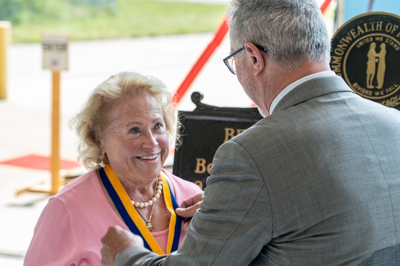 Helen Duer, family member of U.S. Army Capt. Bee Rife Osborne, receives the gold Order of St. Michael award at the 110th anniversary celebration of Kentucky Army National Guard aviation, held at the Army Aviation Support Facility on Boone National Guard Center in Frankfort, Kentucky, Aug. 15, 2025.