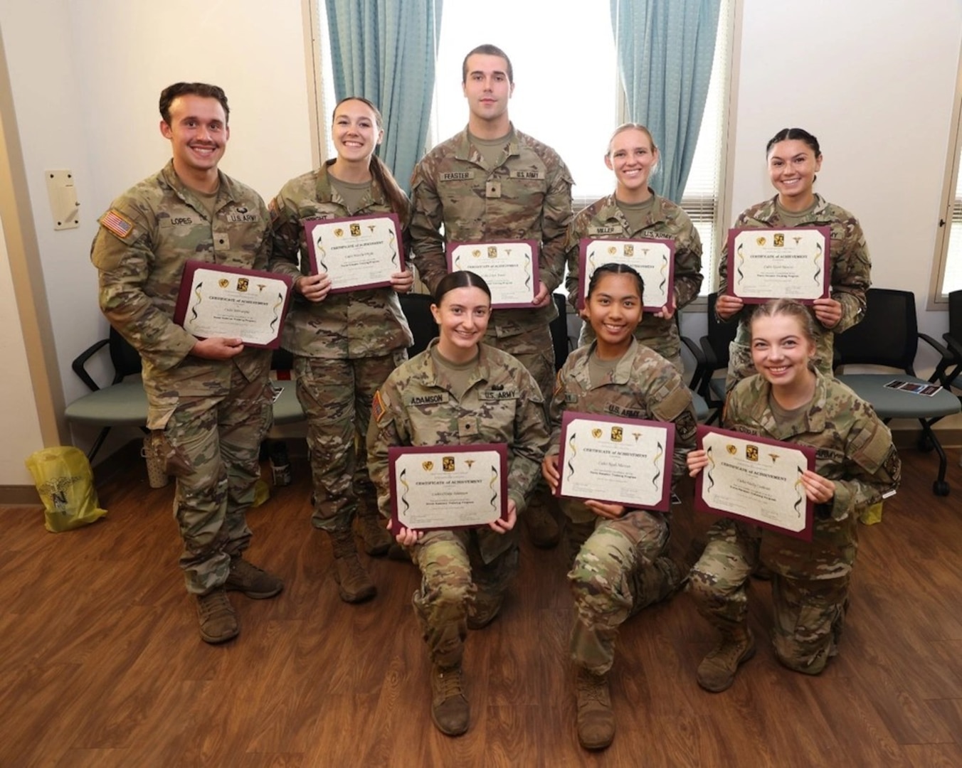 Left to Right: Cadet John Lopes, Cadet Priscilla Wright, Cadet Jakob Feaster, Cadet Madison Miller, Cadet Nicole Narciso; Kneeling: Cadet Olivia Adamson, Cadet Nyah Marzan, Cadet Molly Cochran.