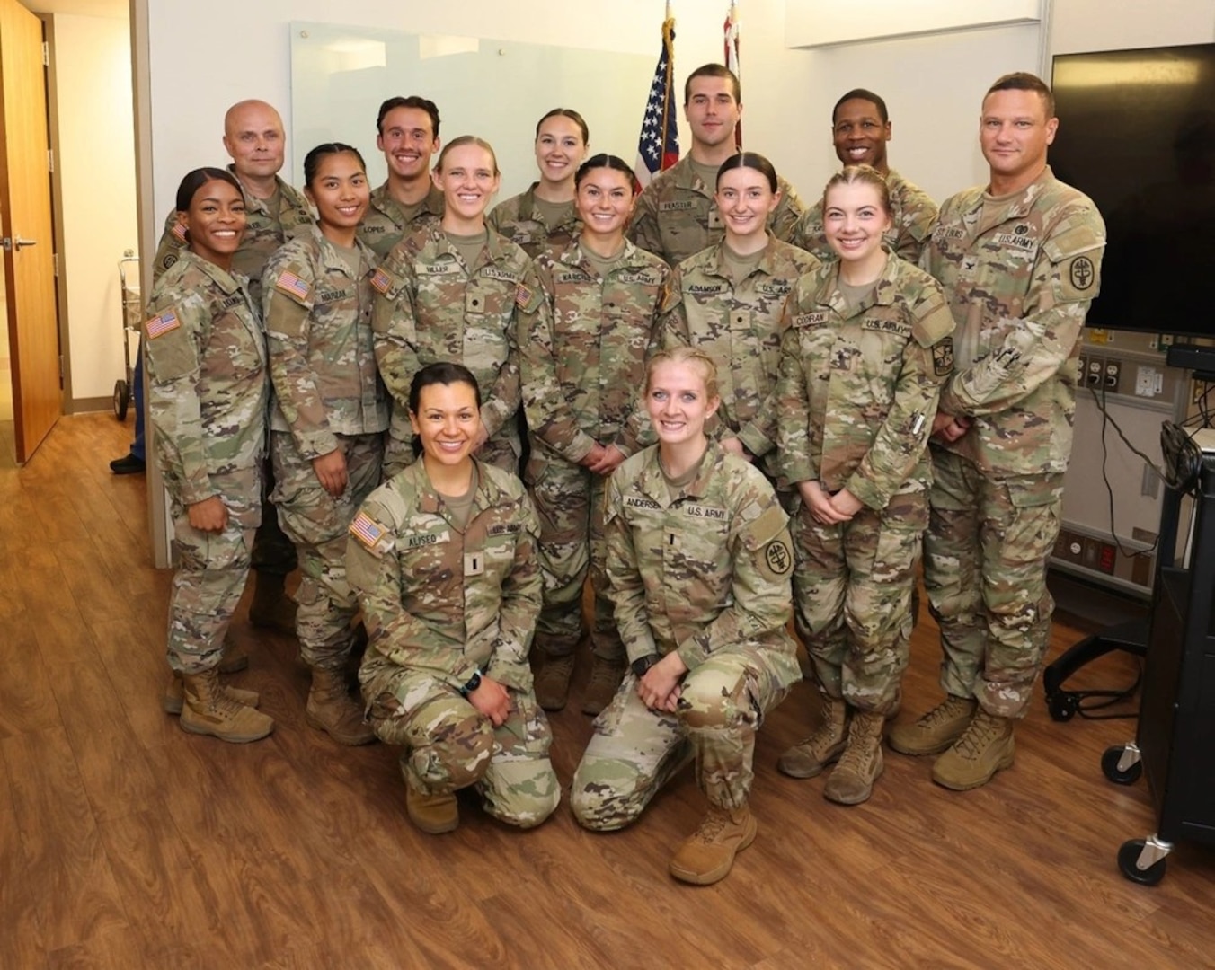 All smiles on graduation day (From Left to Right: Back row: Col. Donald Kimbler, Cadet John Lopes, Cadet Priscilla Wright, Cadet Jakob Feaster, Maj. Cameron Player, Col. Guy St. Louis; Middle row: Capt. Carmen Williams, Cadet Nyah Marzan, Cadet Madison Miller, Cadet Nicole Narciso, Cadet Olivia Adamson, Cadet Molly Cochran; Kneeling: 1st Lt. Keely Aliseo, 1st Lt. Kathryn Anderson)