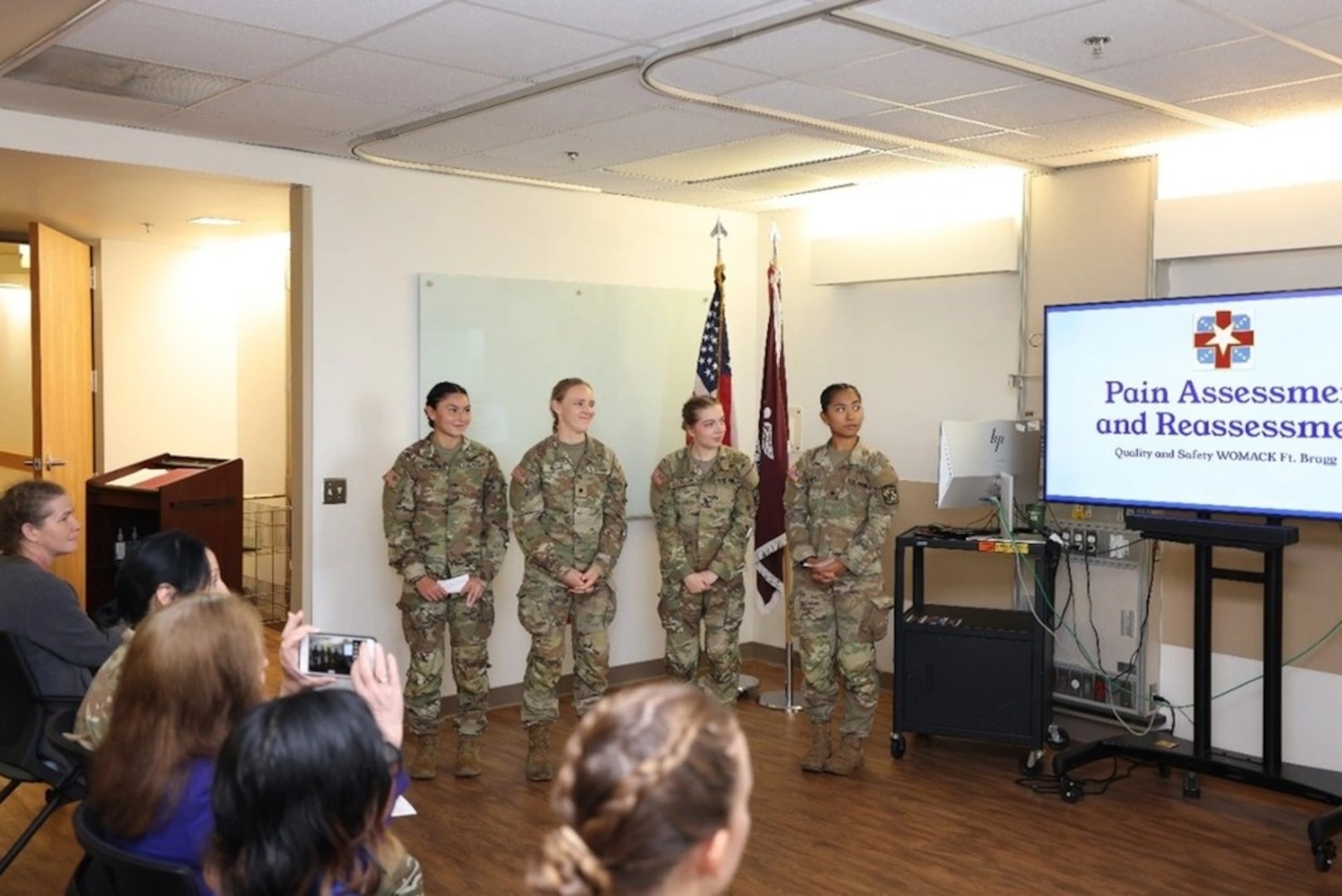 The Nurse Summer Training Program Cadets presenting their Joint Professional Practice Model Tenet (From Left to Right: Cadet Nicole Narciso, Cadet Madison Miller, Cadet Molly Cochran, Cadet Nyah Marzan)