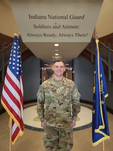 Warrant Officer 1 Tyler McKay, an Indiana National Guard Soldier, poses for a photo following his pinning ceremony.