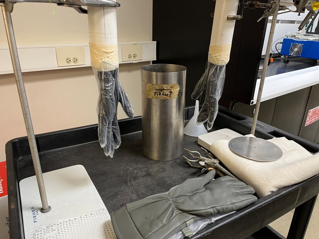 Rubber and plastic layers shield these 3D hand models from the harsh effects of fuel during rigorous glove testing. Once a test glove shown below is on, it's straight to the fuel bath.