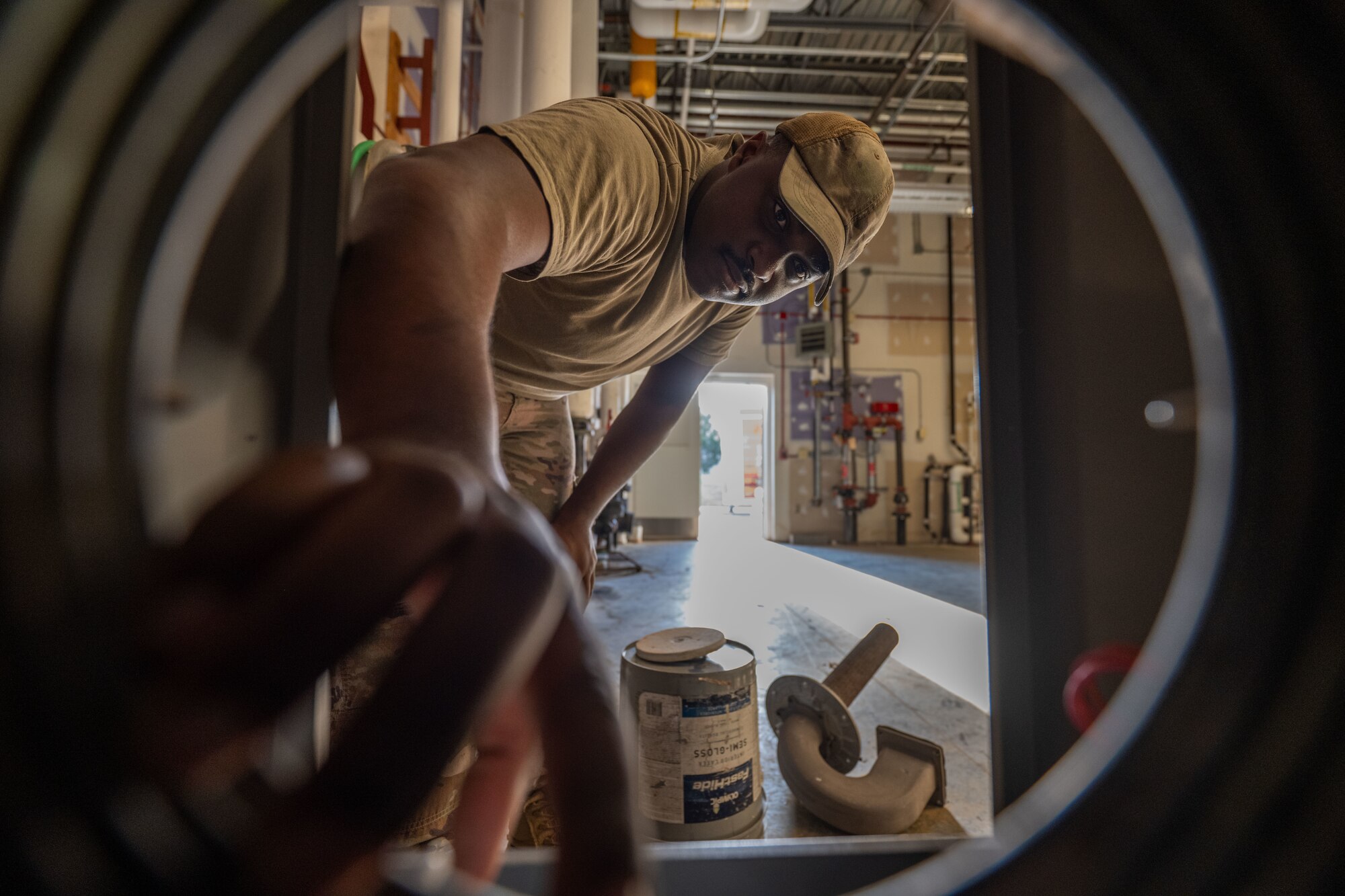 Senior Airman Kelby Finch, 22nd Civil Engineer Squadron heating, ventilation and air conditioning technician, works on a disassembled boiler at McConnell Air Force Base, Kansas, Aug. 19, 2025. Finch inspected the boiler for signs of leaks, corrosion, rust and cracks. (U.S. Air Force photo by Airman 1st Class Paula Arce)