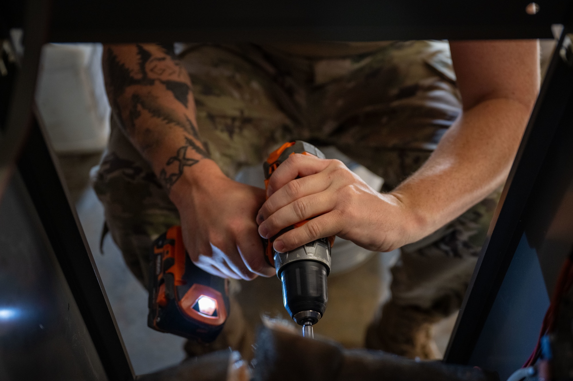 Staff Sgt. Daniell Blade, 22nd Civil Engineer Squadron heating, ventilation and air conditioning technician performs maintenance on a boiler at McConnell Air Force Base, Kansas, Aug. 19, 2025. Once the maintenance was completed, Blade reassembled the boiler and performed operational testing. (U.S. Air Force photo by Airman 1st Class Paula Arce)