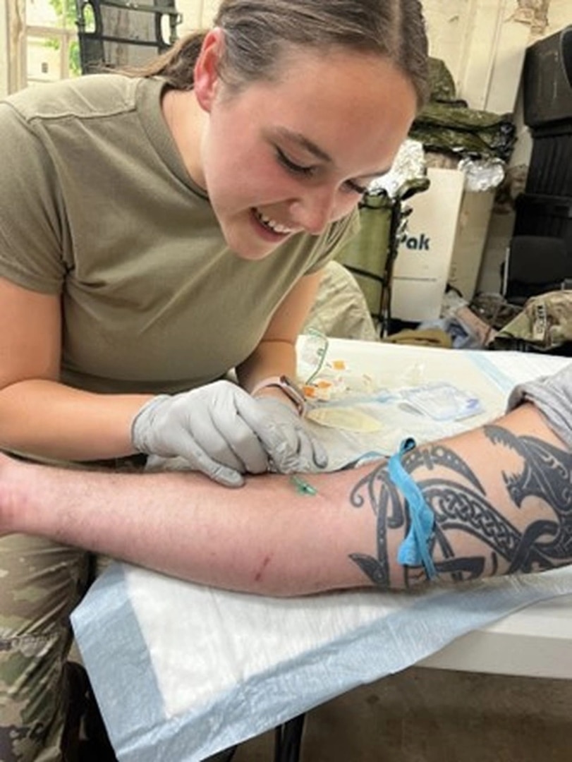 Cadet Priscilla Wright successfully places an IV on a volunteer during Tactical Combat Casualty Care training (TCCC)