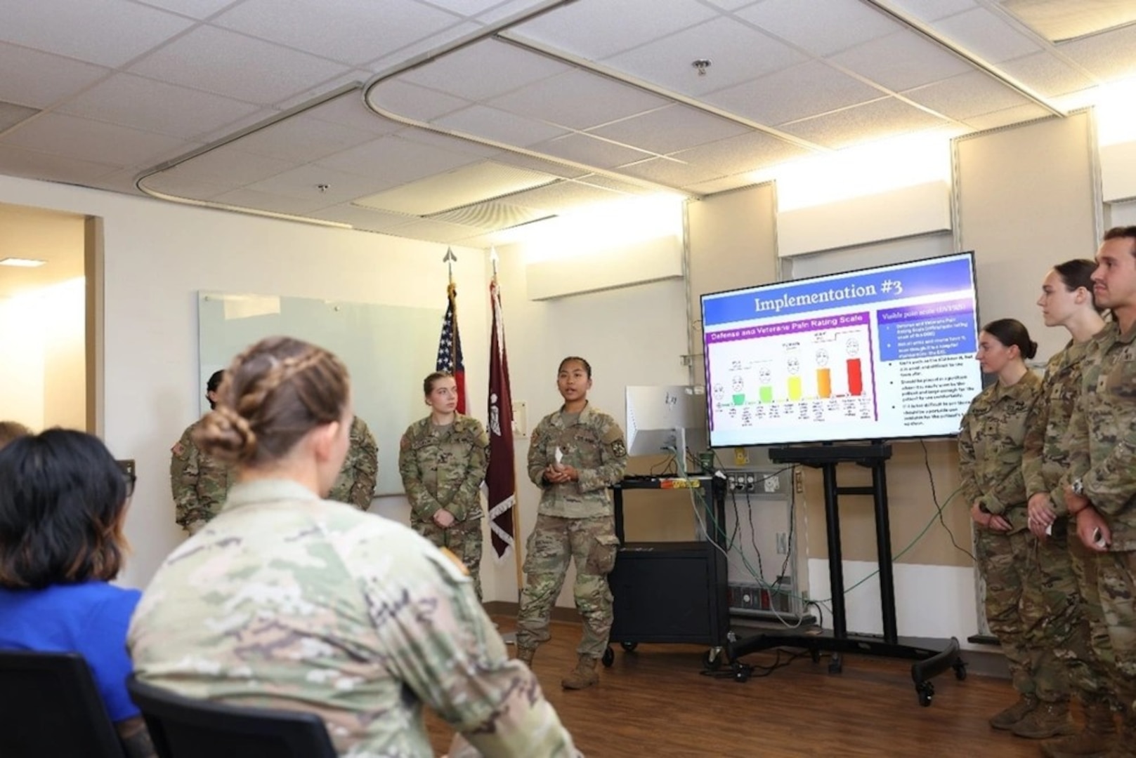 Cadet Nyah Marzan briefs her section of the Joint Professional Practice Model Presentation.