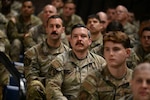 Crowd shots of people in military camo uniform