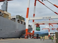 Soldiers from the 593rd CSC’s Distribution Management Center (DMC) and Surface Deployment Distribution Command (SDDC) oversee port operations in the Philippines during SABAK 25, coordinating the upload of critical cargo alongside commercial partners to ensure mission success.