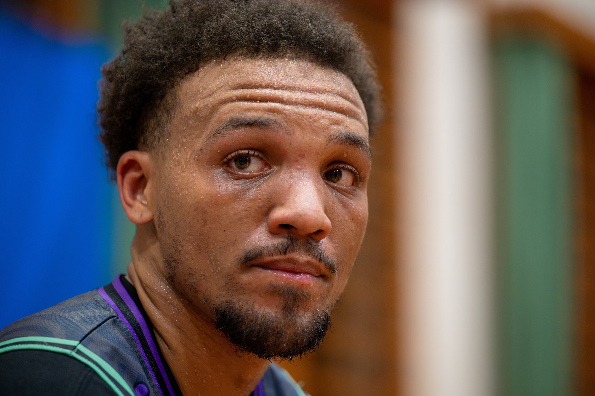 A basketball player takes a break during halftime