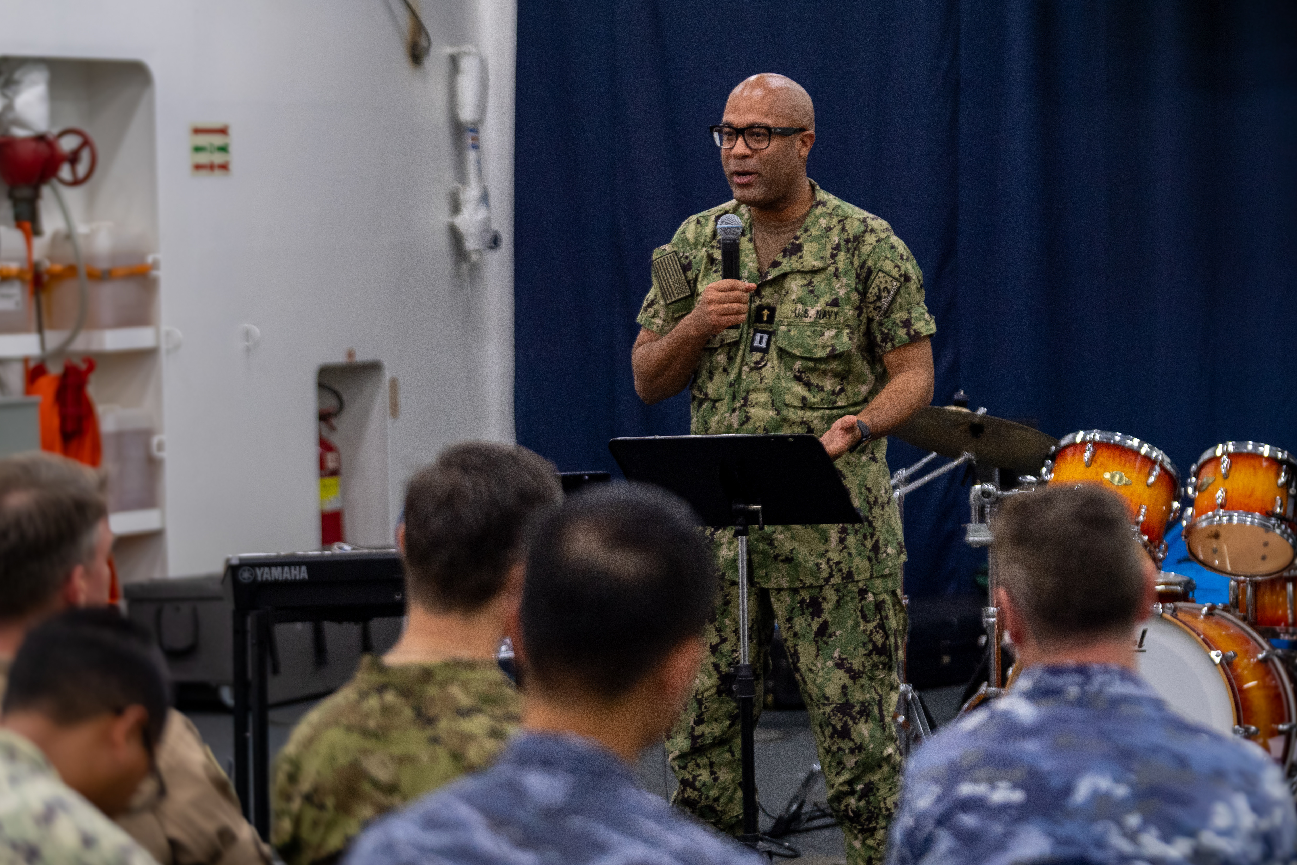 Pacific Partnership 2025 multinational team member U.S. Navy Lt. Reginald Anderson-Exul speaks during a chaplains combined prayer service aboard the Il Chul Bong, July 30, 2025. Now in its 21st iteration, the Pacific Partnership series is the largest annual multinational humanitarian assistance and disaster management preparedness mission conducted in the Indo-Pacific.