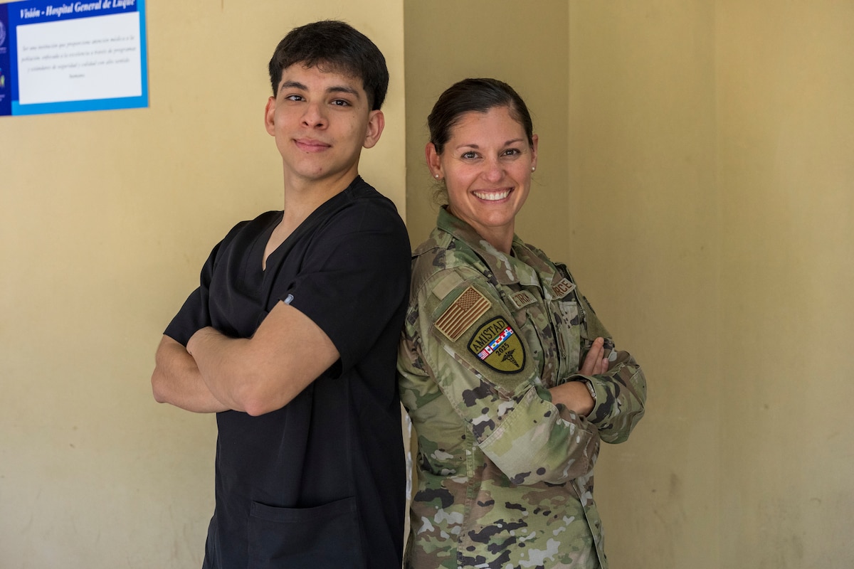 U.S. Air Force Maj.Carolyn Hetrick, 507th Medical Squadron dentist, poses with Paraguayan medical student Nico Rodriguez during AMISTAD 2025, at Hospital General de Luque, in Paraguay, Aug. 14, 2025. The global health engagement brought together United States service members and Paraguayan health professionals who shared expertise, improved readiness and built enduring relationships. (U.S. Air Force photo by Andrea jenkins)