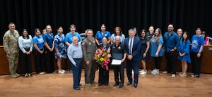 Roberto ”Bobby” Barrera, RBB Elementary STEM Magnet School faculty and staff, Laughlin Air Force Base leadership and San Felipe Del Rio Consolidated Independent School District (SFDRCISD) school board members pose together for a group photo in Del Rio, Texas, Aug. 18, 2025.  RBB were honored by Team XL and SFRDCISD for being named a 2025 Blue Ribbon Lighthouse School. (U.S. Air Force photo by Capt. Christine Del Aguila.)