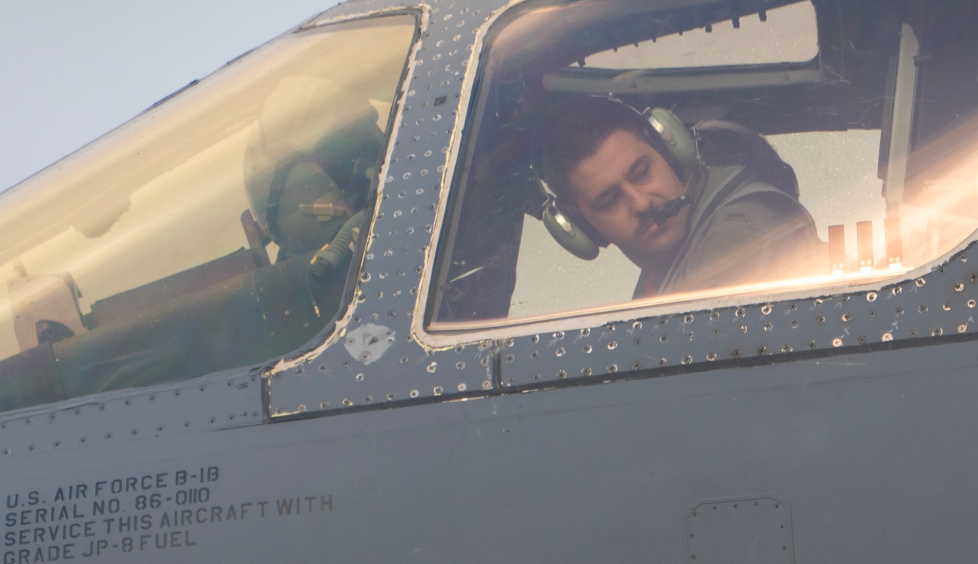 airman in a B-1 prepares to taxi in the rain