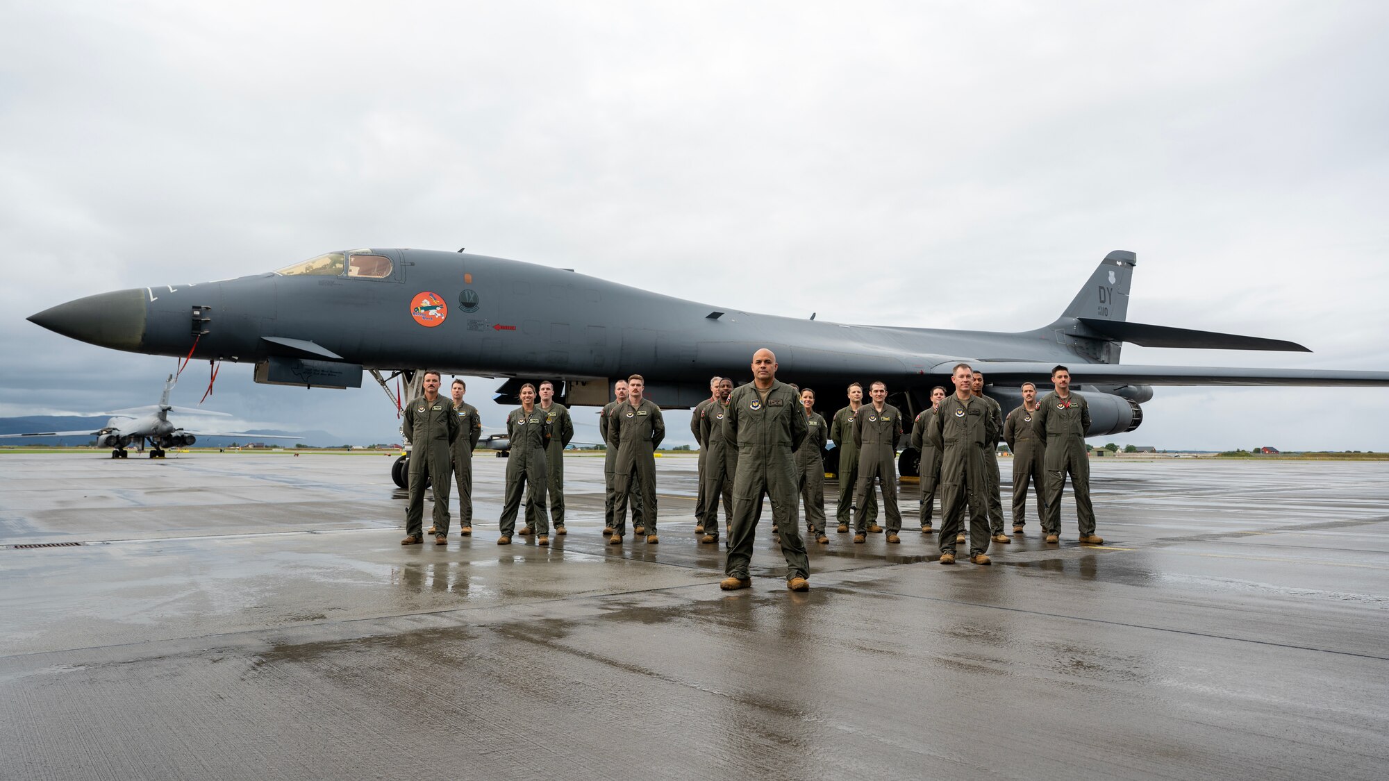 B-1 aircrew pose in formation in front of a B-1