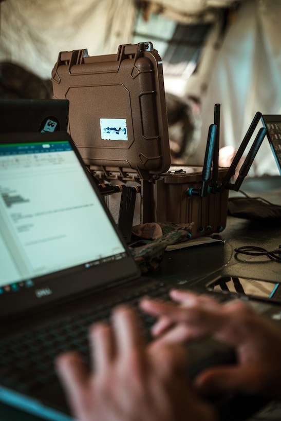 Marines use a 5G expeditionary transmission system during a field training exercise at Camp Lejeune, N.C.
