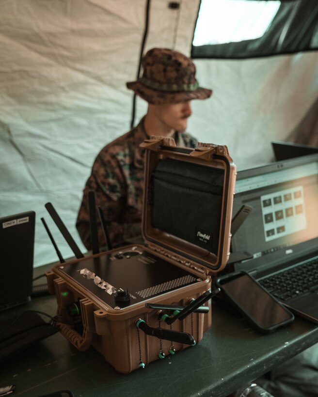 Marines use a 5G expeditionary transmission system during a field training exercise at Camp Lejeune, N.C.
