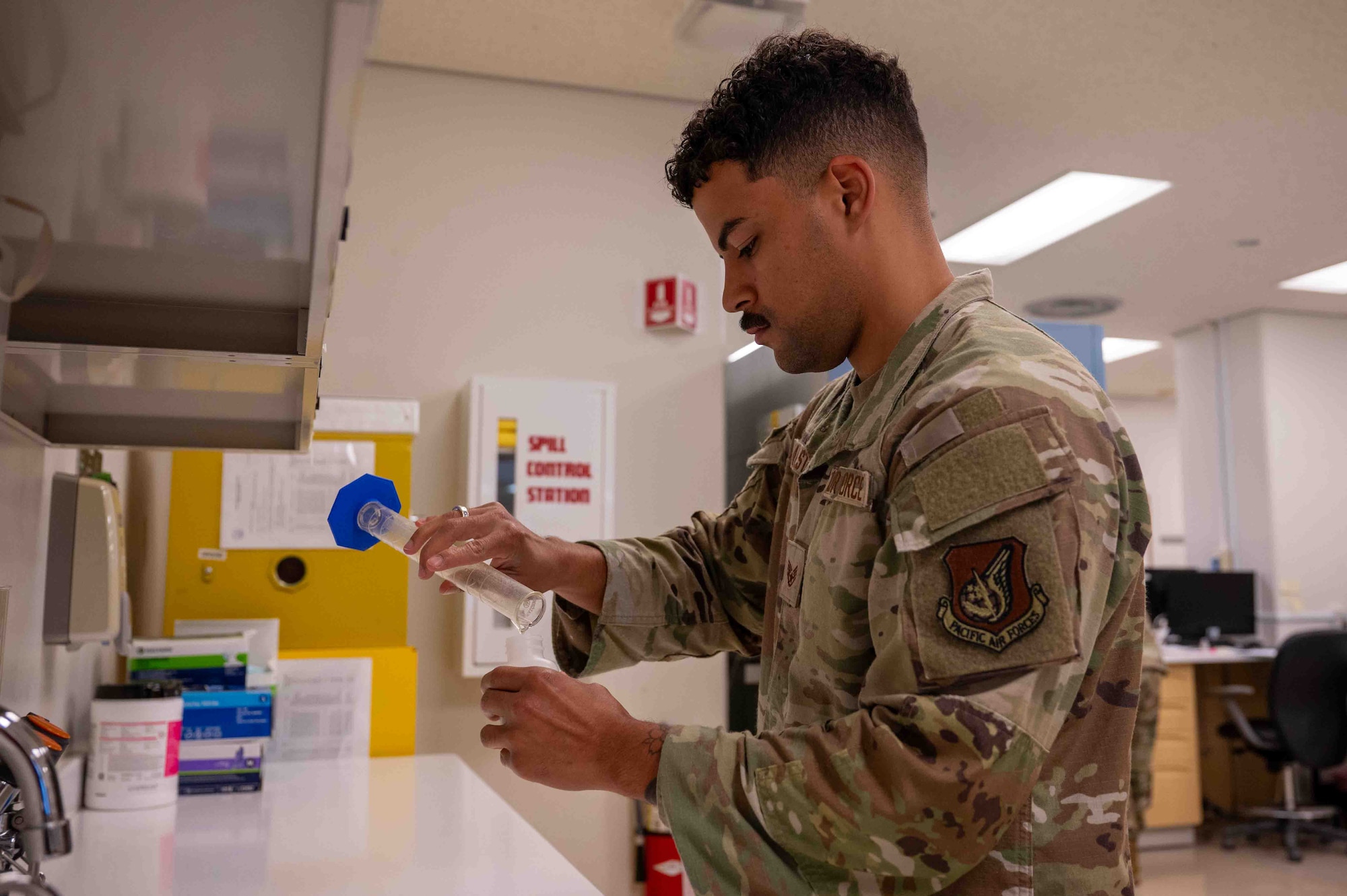A service member fills a prescription.