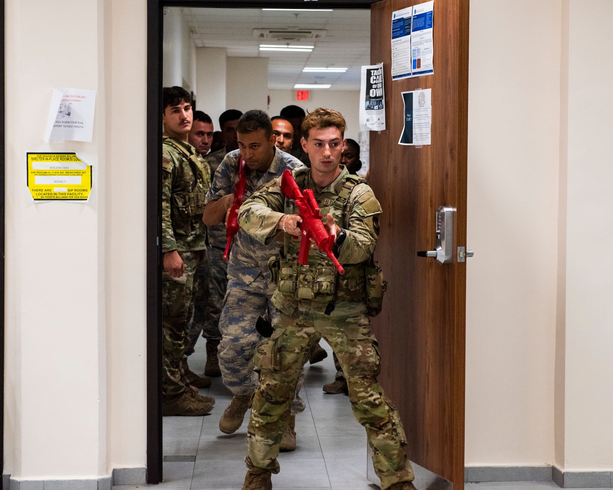 U.S. and Turkish Air Force personnel prepare to clear a room