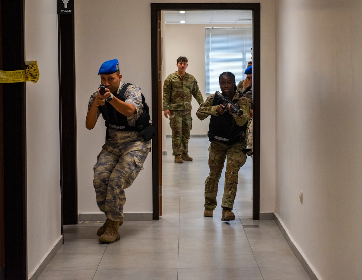 U.S. and Turkish Air Force personnel advance through a hallway during an active shooter exercise at Incirlik Air Base, Türkiye, Aug. 19, 2025.
