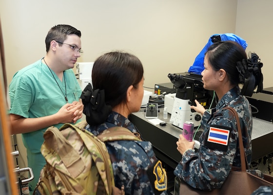JOINT BASE SAN ANTONIO-FORT SAM HOUSTON – (Aug. 14, 2025) – Flight nurses from the Royal Thai Air Force speak with Dr. Daniel Thompson, a research scientist assigned to Naval Medical Research Unit (NAMRU) San Antonio’s Craniofacial Health and Restorative Medicine directorate, about a confocal microscope during a tour of laboratory facilities at the Battlefield Health and Trauma Research Institute. Four Royal Thai Air Force nurses visited medical commands within Joint Base San Antonio to enhance their nursing knowledge and skills to include advancing quality of nursing practice related to disease management. Navy Medicine Research & Development (NMR&D) contributes directly to positive working relationships with partner nation militaries, keeping the scope of Department of Defense capabilities wide, and at the ready, to address emerging threats aboard. NAMRU San Antonio, part of NMR&D, conducts gap-driven combat casualty care, craniofacial, and directed energy research in support of Navy, Marine Corps and joint U.S. warfighter health readiness and lethality while engaged in routine and expeditionary operations. (U.S. Navy photo by Burrell Parmer, NAMRU San Antonio Public Affairs/Released)