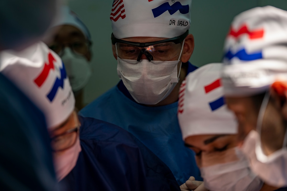 Image of medical professionals treating a patient.