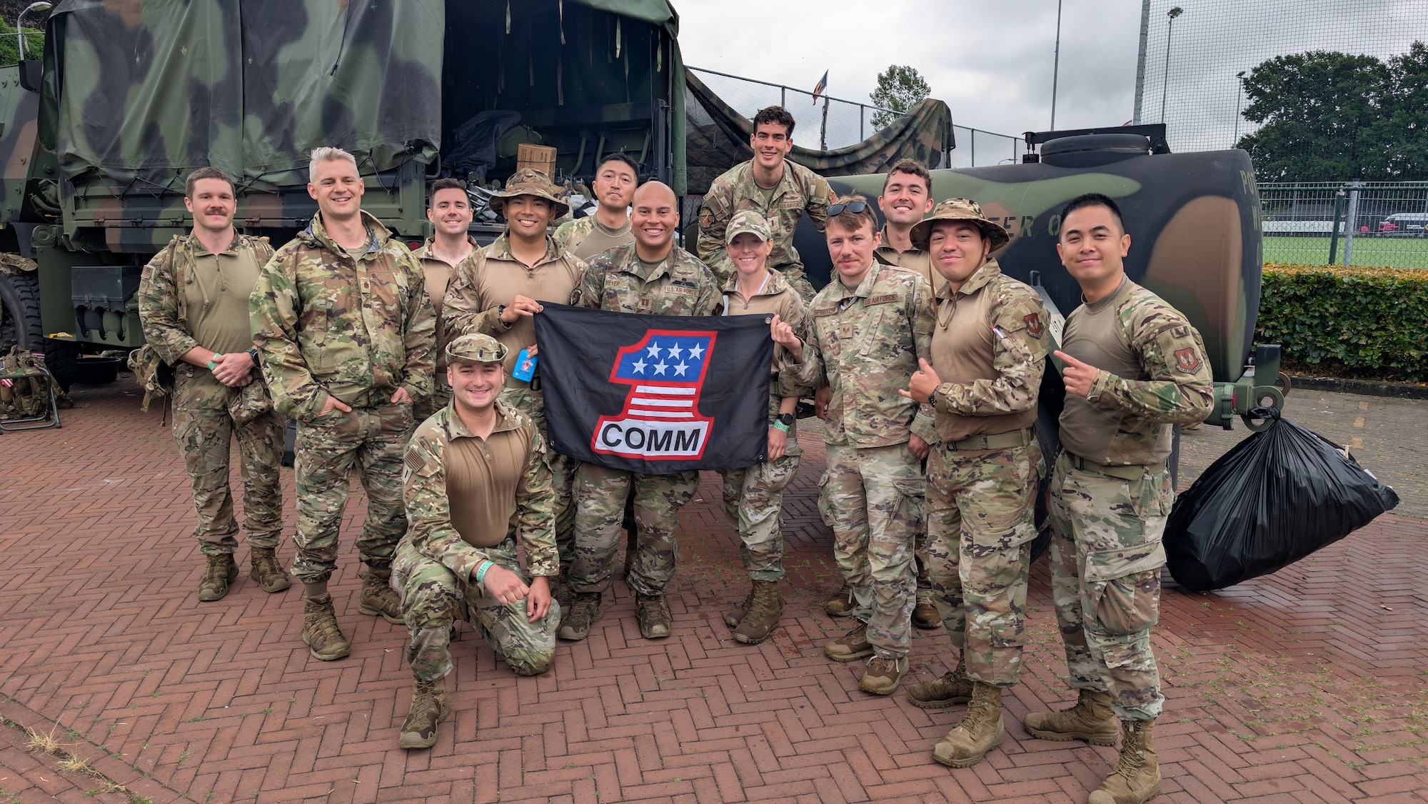 U.S. Airmen assigned to the 1st Combat Communications Squadron, pose for a photo during a 4-day ruck march across 106 miles in the Netherlands, July 15-18, 2025.