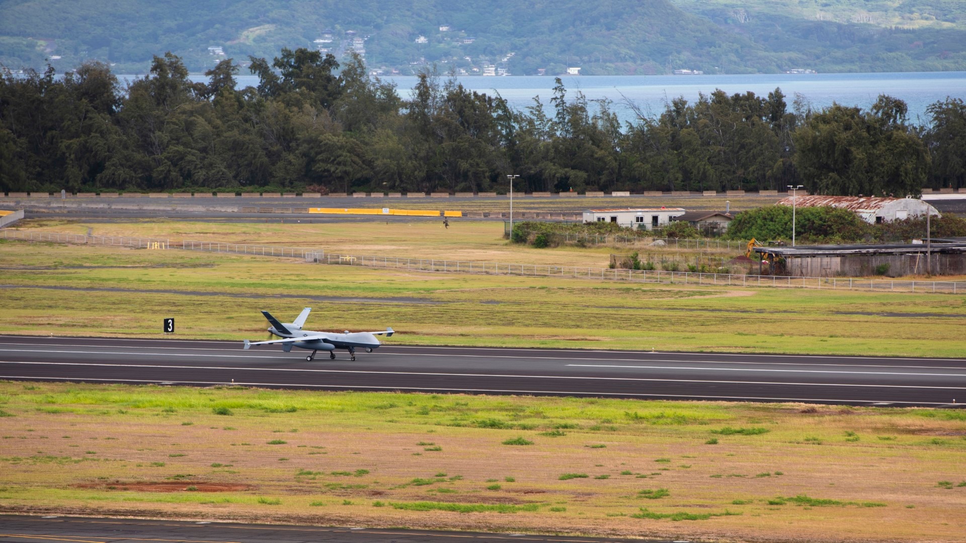 An MQ-9A Reaper assigned to the 163d Attack Wing, California Air National Guard, lands at Marine Corps Base Hawaii, Hawaii, while en route to integrated coalition training with Indo-Pacific partners to practice and evaluate shared security objectives on July 16, 2025.