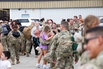 Indiana National Guard soldiers with the 38th Infantry Division celebrate with their family and loved ones at the Indianapolis International Airport, Wednesday, Aug. 20, 2025. The soldiers deployed in September 2024 to the Middle East to support Operation Spartan Shield, which helps to maintain and strengthen defense relationships and also helps build partner capacity.
