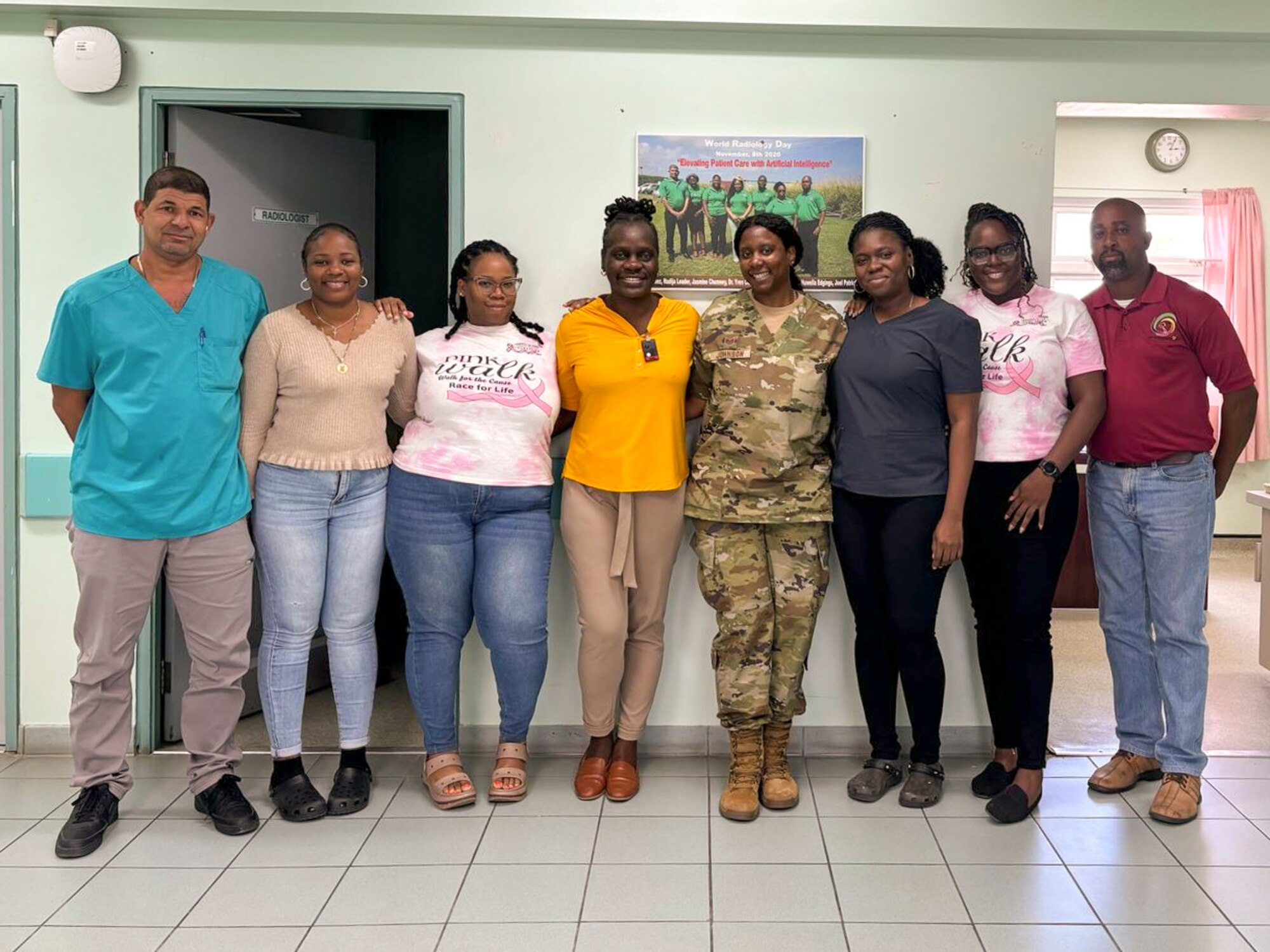 Tech. Sgt. Mallory Johnson, a 433rd Medical Squadron diagnostic imaging technician, poses for a group photo with the radiology team at Joseph N. France General Hospital in Basseterre, Saint Kitts and Nevis, as part of LAMAT 25 April 5, 2025.