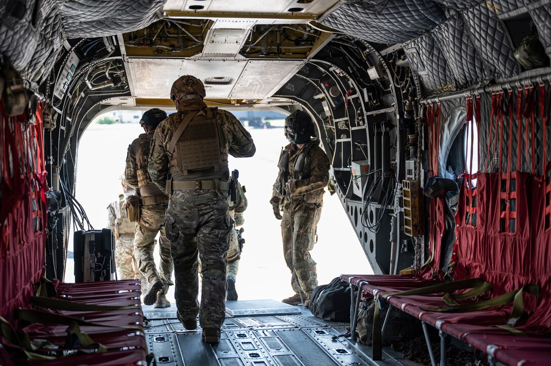 Panamanian soldiers exit a CH-47 Chinook during PANAMAX-Alpha Phase I, at Panama Pacific International Airport, Panama, July 14, 2025. PANAMAX-Alpha Phase I is a government of Panama exercise supported by U.S. Southern Command, focused on security of the canal in Panama. The portion JTF-Bravo is participating in for phase 1 includes providing hot and cold load training, K-9 familiarization and hoist training, medical evacuation, fast rope insertion and aerial overwatch training with our helicopters and partners. (U.S. Air Force photo by Staff Sgt. Sadie Colbert)
