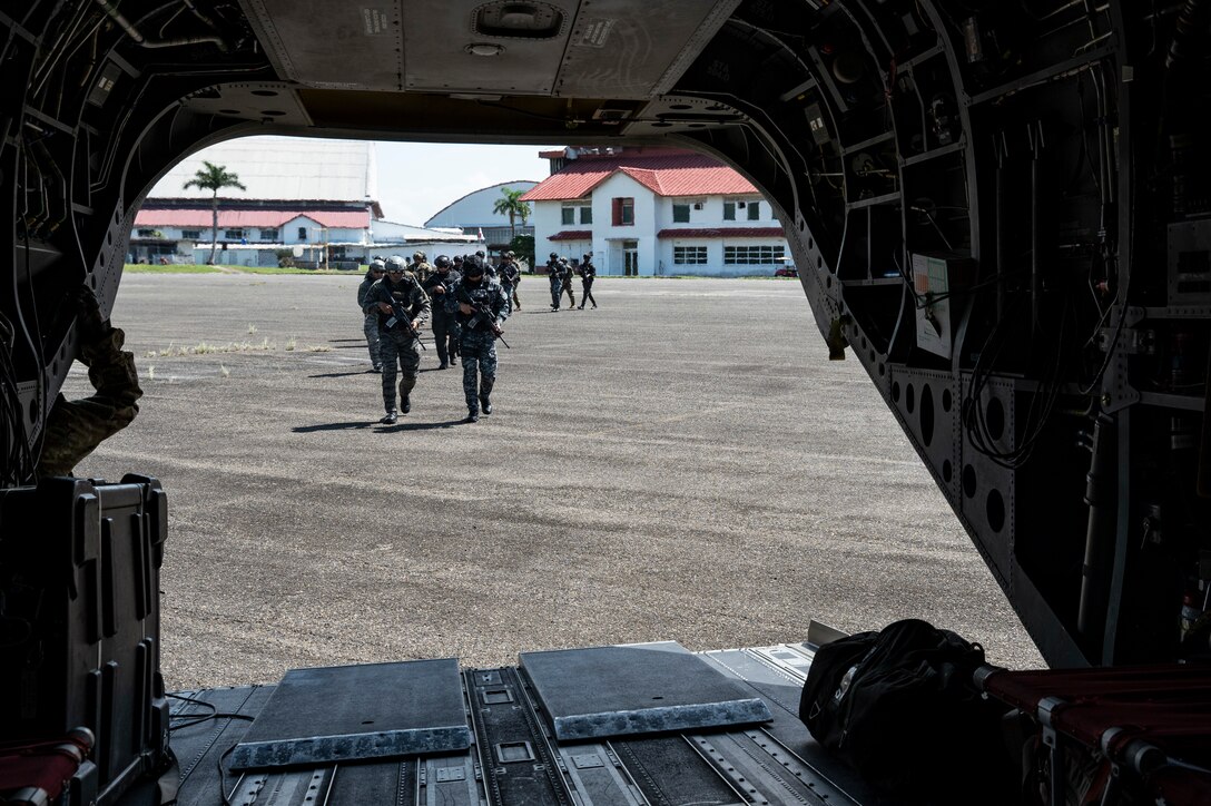 Panamanian soldiers board a CH-47 Chinook during PANAMAX-Alpha Phase I, at Panama Pacific International Airport, Panama, July 14, 2025. PANAMAX is an annual joint exercise designed to enhance interoperability among participating nations and strengthen their ability to conduct multinational operations, particularly to defend the Panama Canal. (U.S. Air Force photo by Staff Sgt. Sadie Colbert)
