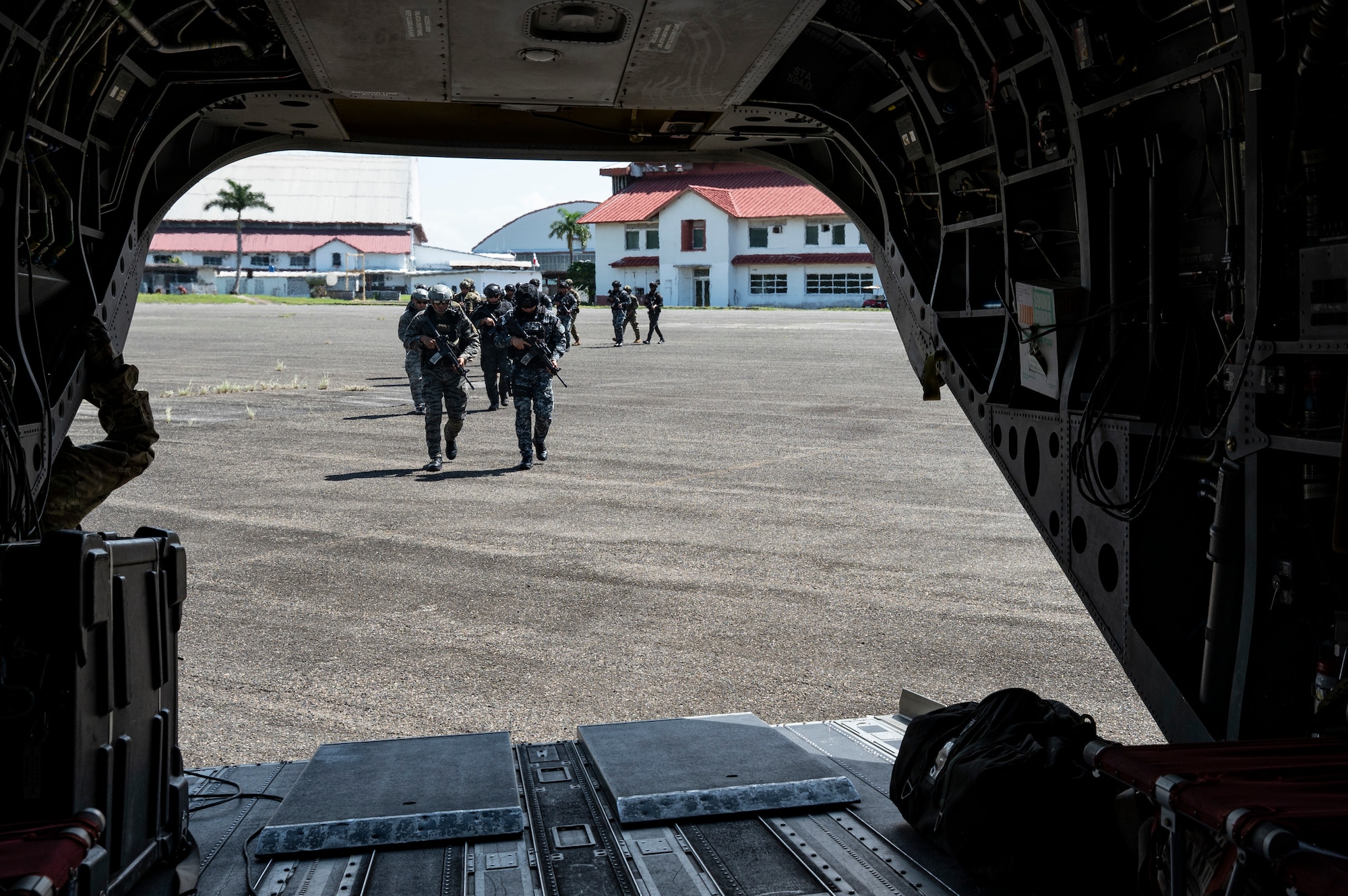 Panamanian soldiers board a CH-47 Chinook during PANAMAX-Alpha Phase I, at Panama Pacific International Airport, Panama, July 14, 2025. PANAMAX is an annual joint exercise designed to enhance interoperability among participating nations and strengthen their ability to conduct multinational operations, particularly to defend the Panama Canal. (U.S. Air Force photo by Staff Sgt. Sadie Colbert)